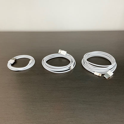White cords of 3, 6, and 10 foot on a gray tabletop