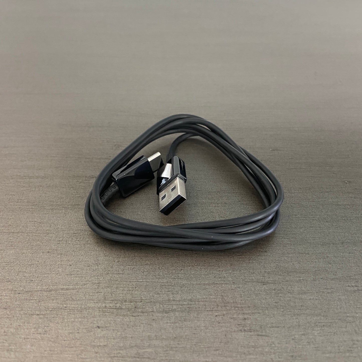 Black USB-C 3ft cord on gray tabletop